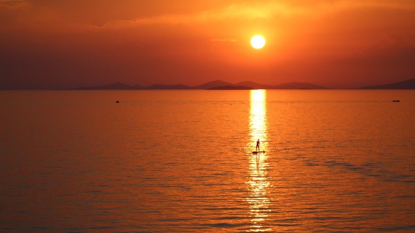 paddleboarder in the sunset
